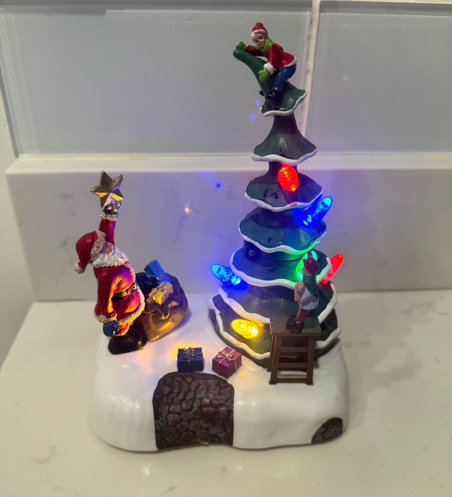 2023 Holiday time Light Up & Musical Christmas Village Decorating the Tree scene
