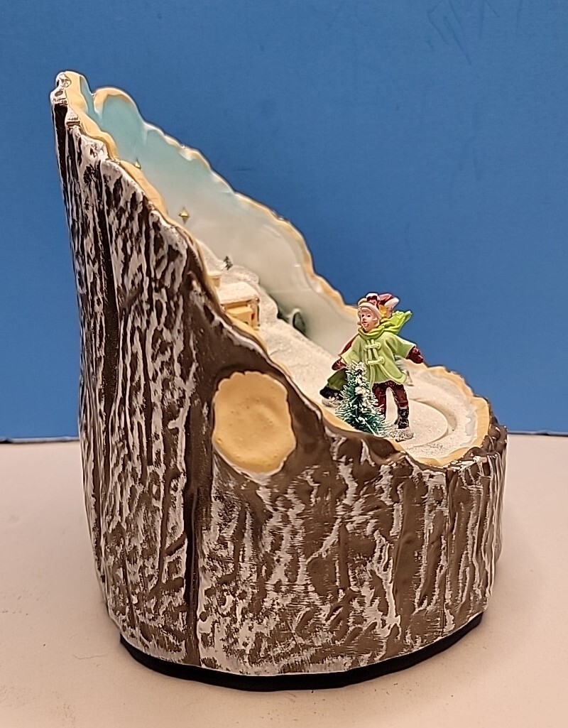 Musical Christmas Rotating Ice Skating Light Up Tree Stump Pan Asian Creations.
