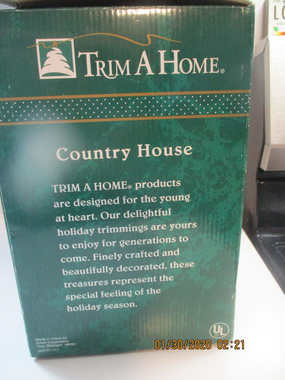 Vintage Trim A Home Country House with Lit Interior Scene & Trees