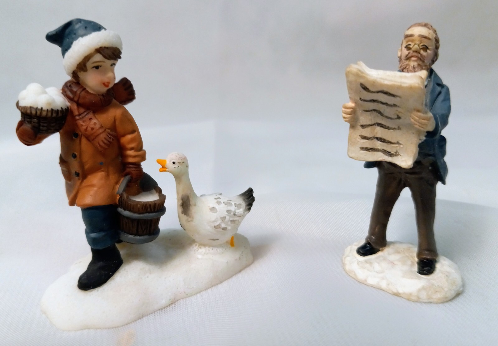 Two Christmas Village Resin Figurines In Different Scenes #V102. WV