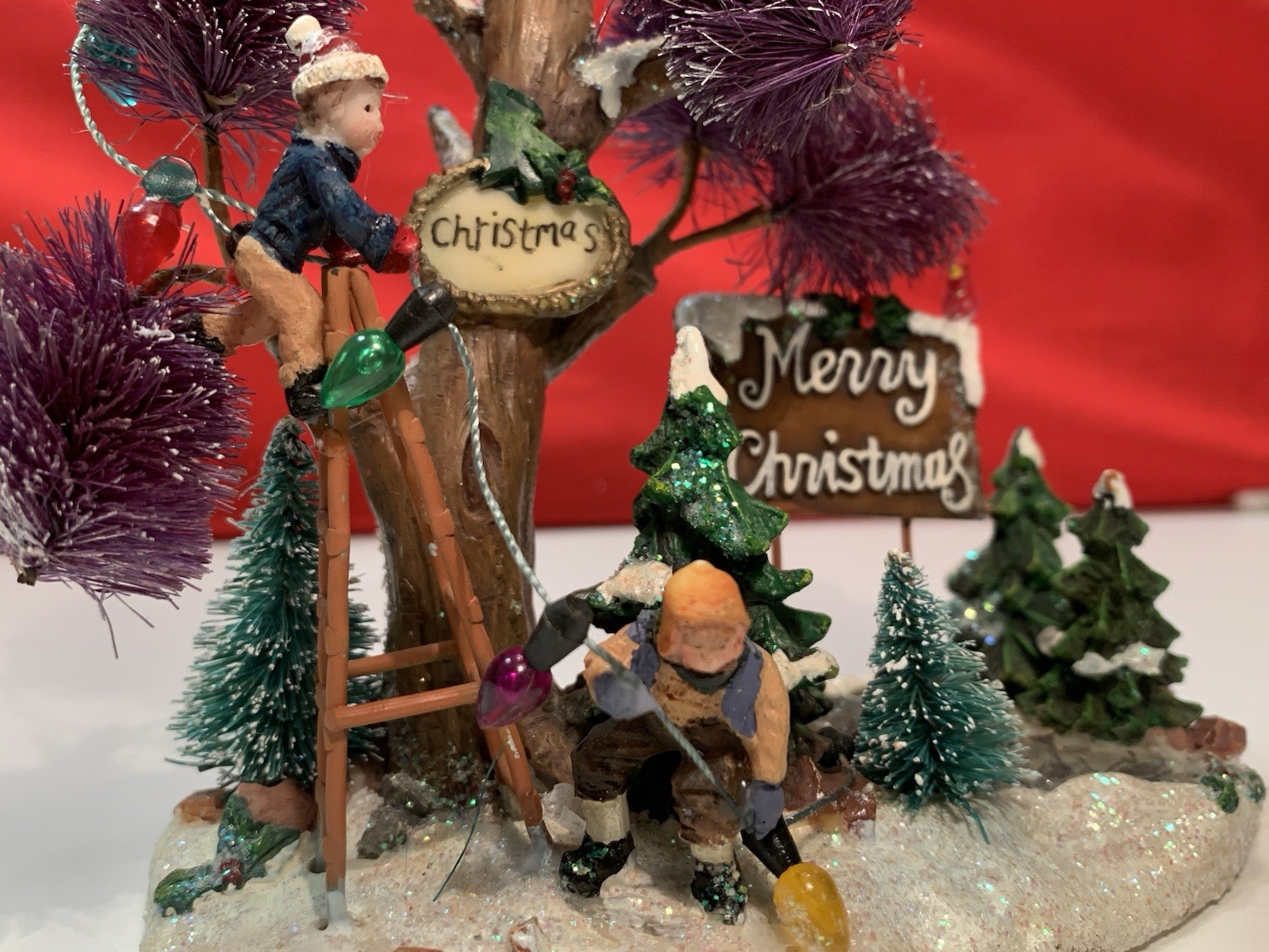 Merry Christmas Decorating The Tree With Lights Christmas Village Figurine 5.5″