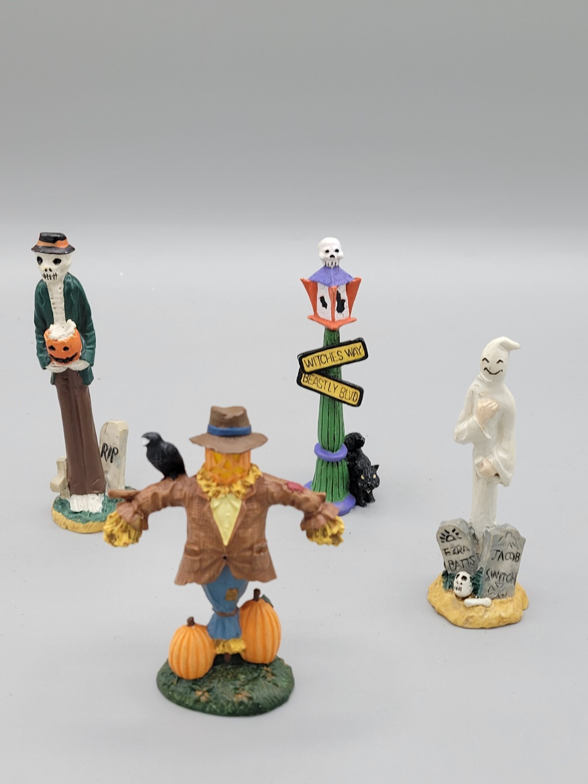 Lot of 4 Halloween Village Figures Scarecrow Ghost Skeleton Lamppost 3-4″
