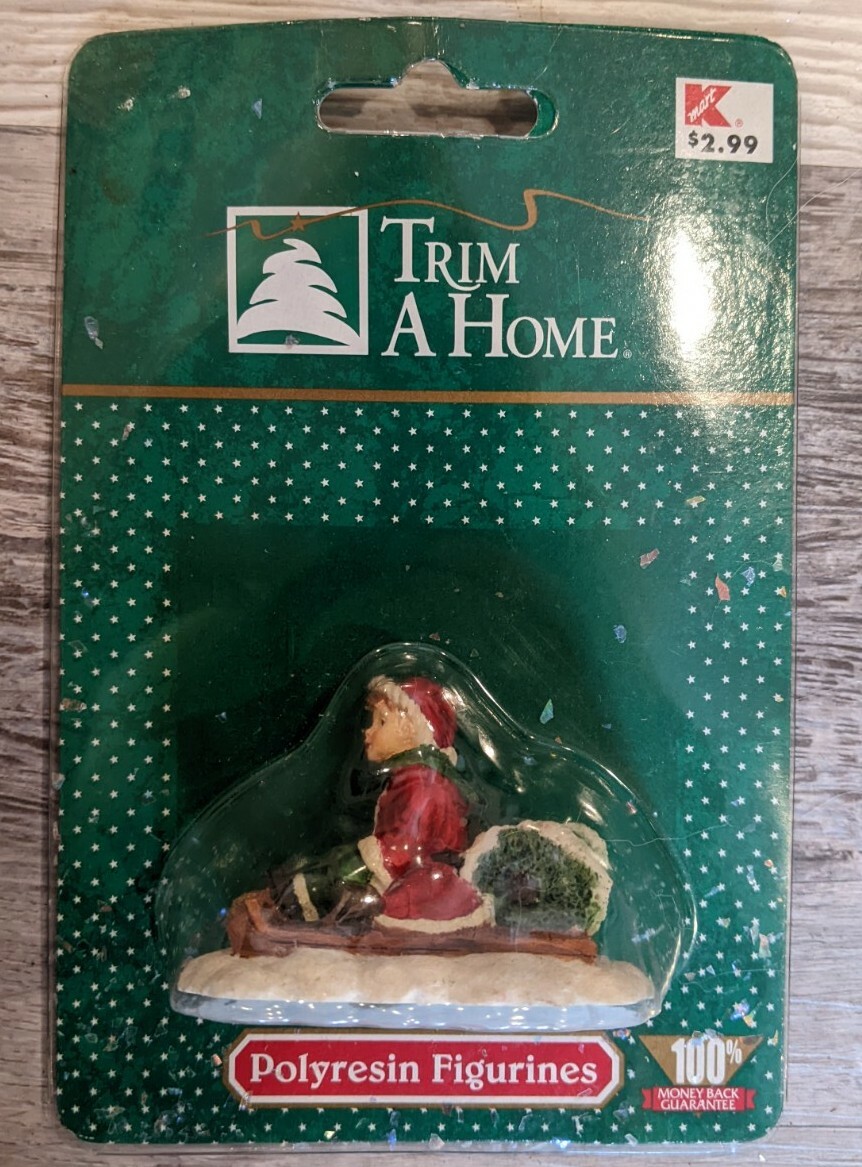 K-Mart Trim At Home Polyresin Figurine Child On Sled NOS Village Accessory