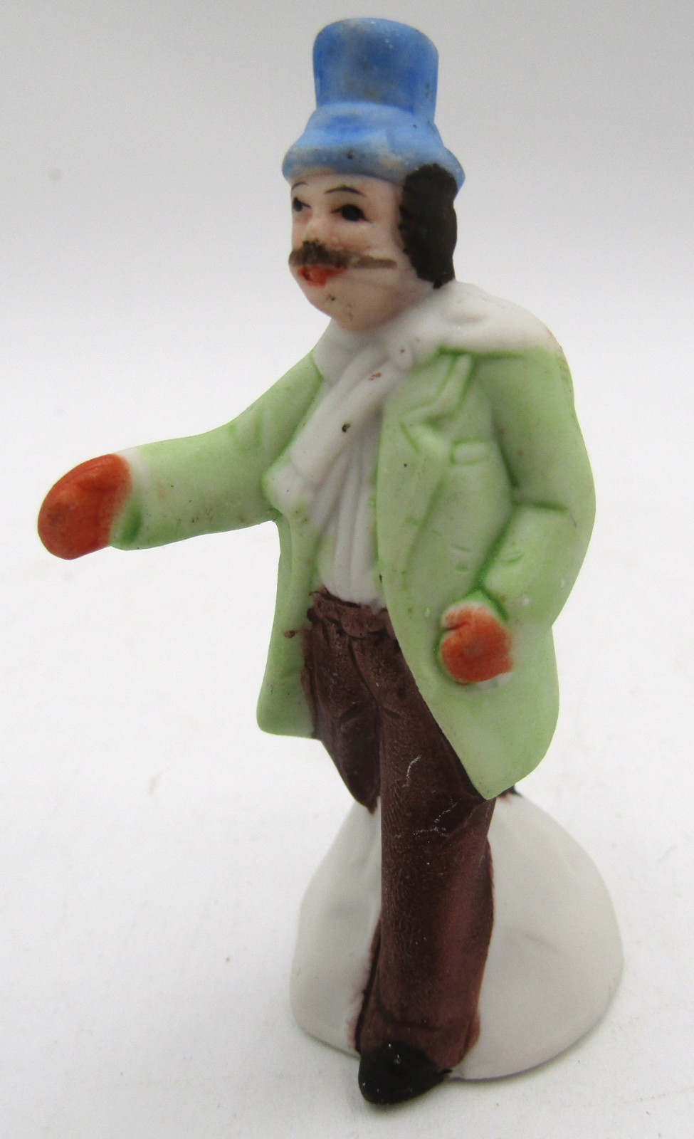 Assorted Ceramic Christmas Village Figurines. Set of 4.