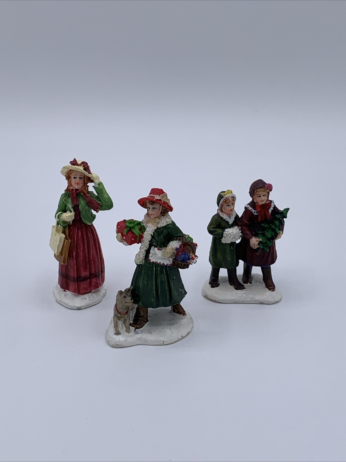Lot of 3 Unbranded Christmas Village Figurines Tallest is 2.5 inches
