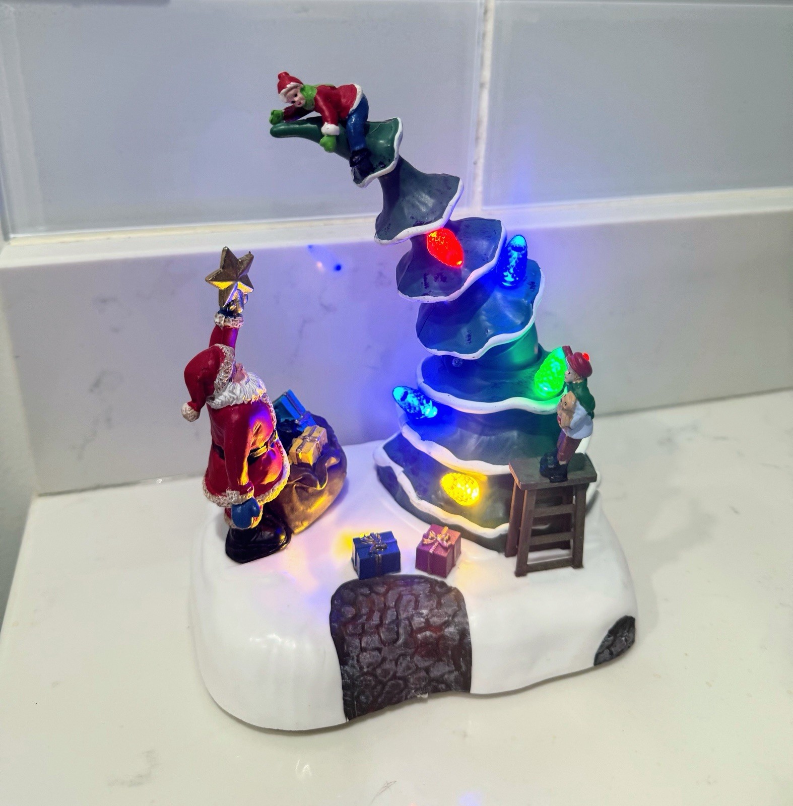 2023 Holiday time Light Up & Musical Christmas Village Decorating the Tree scene