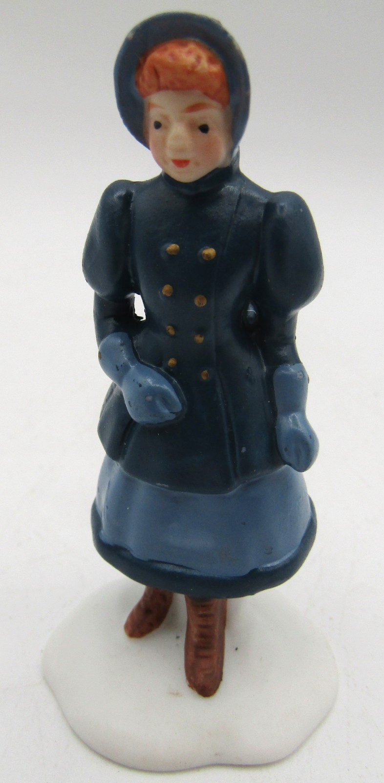 Assorted Ceramic Christmas Village Figurines. Set of 4.
