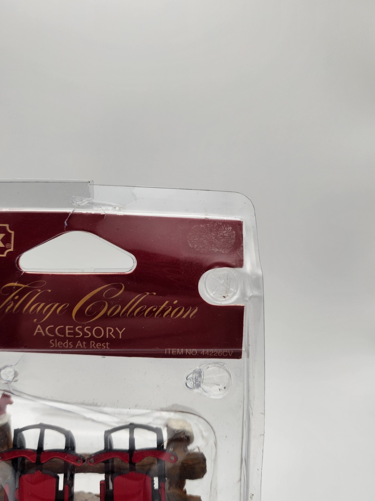 Christmas Village Accessory Sleds At Rest Sleds on Fence Lemax Village 44226CV