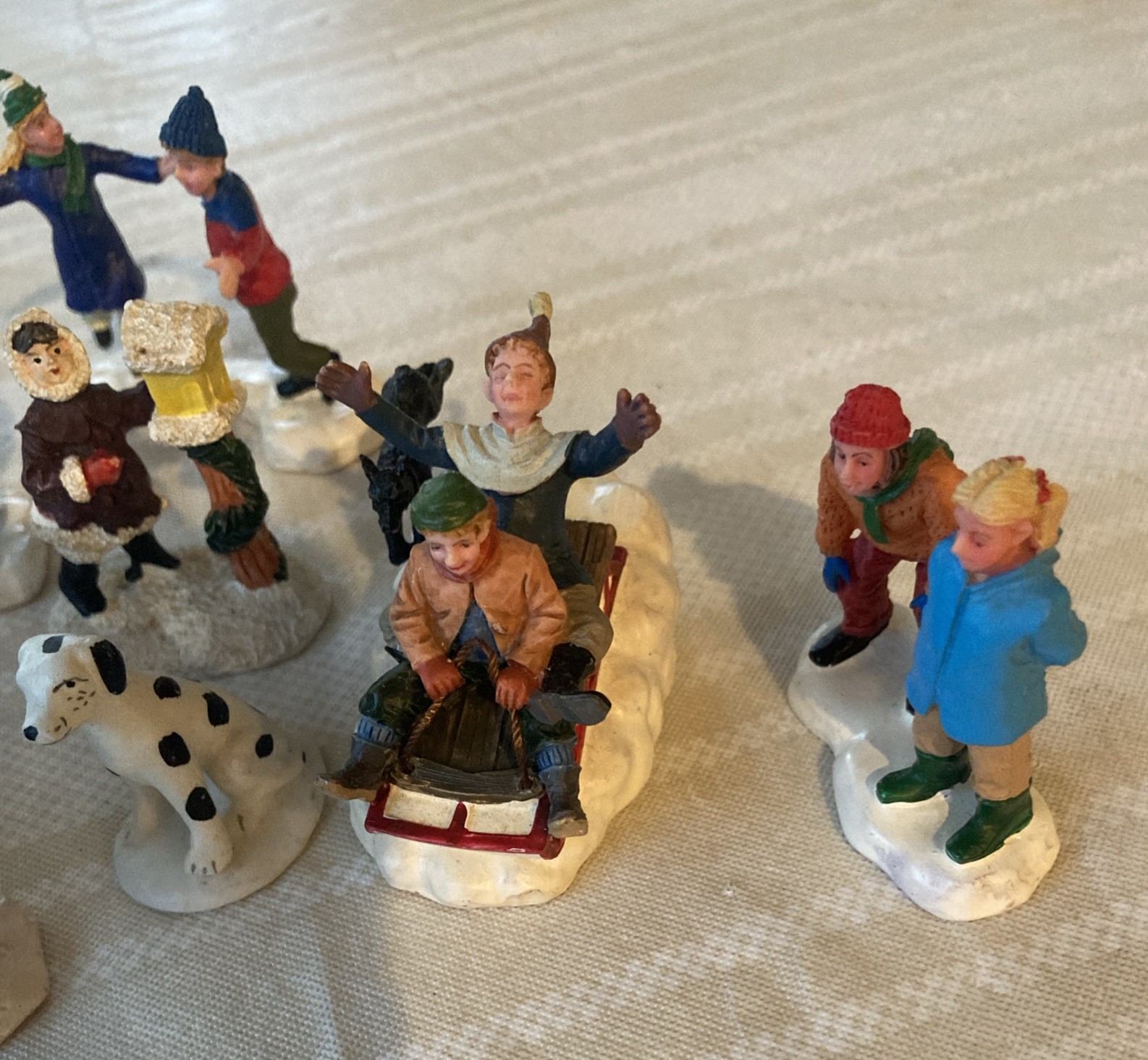8 Pc Christmas Village Ice Skaters, Sledding, Snowman