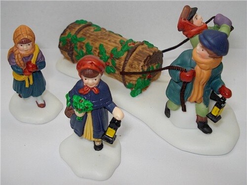 HERITAGE VILLAGE COLLECTION “BRINGING HOME THE YULE LOG” #5558-1 IN ORIGINAL BOX