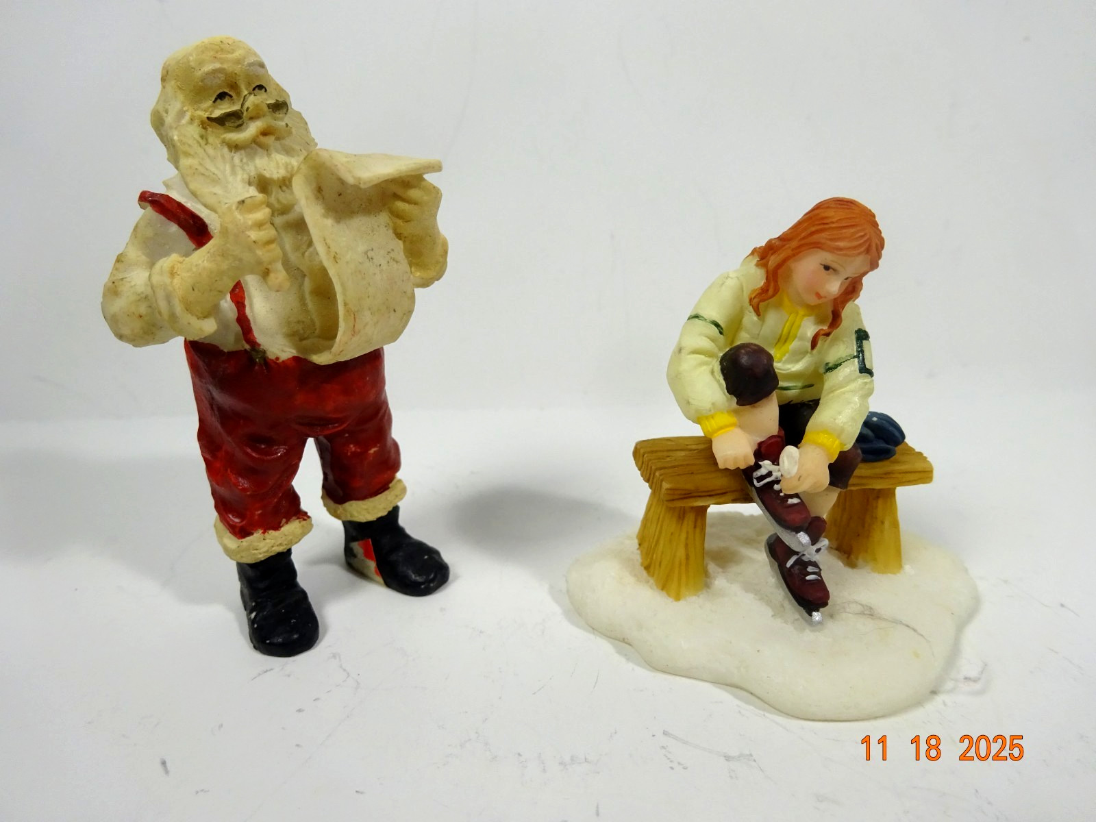 O’Well Christmas Village Resin Figure Santa and Girl Putting On Ice Skates
