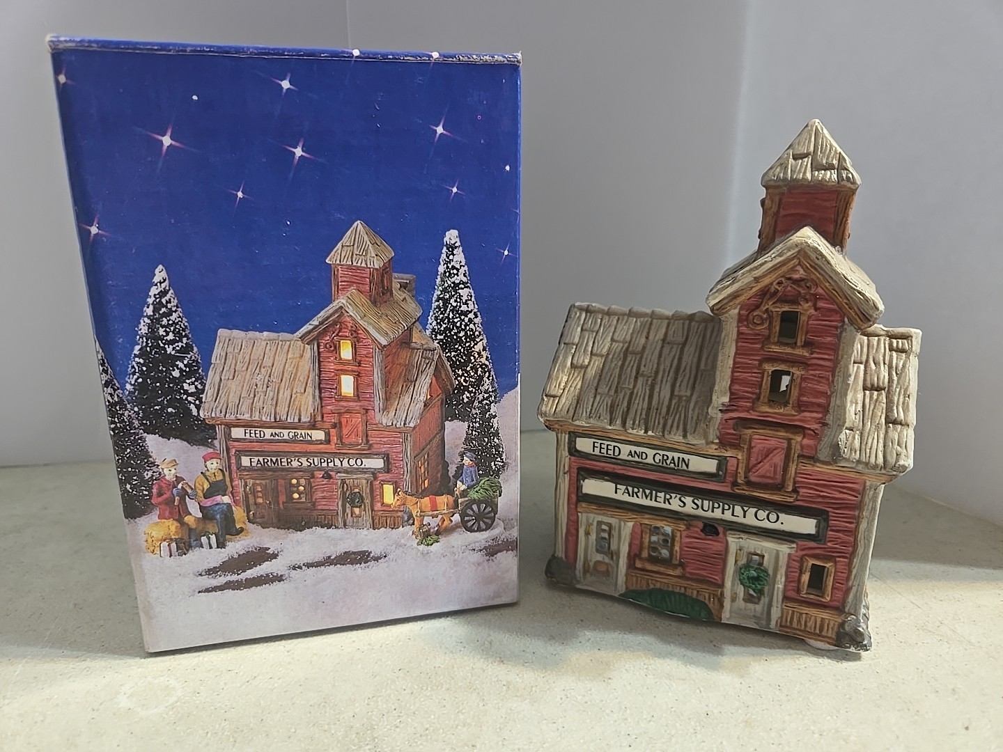 Home Town America Porcelain Home Town Feed and Grain. 1995. 5″ Tall.
