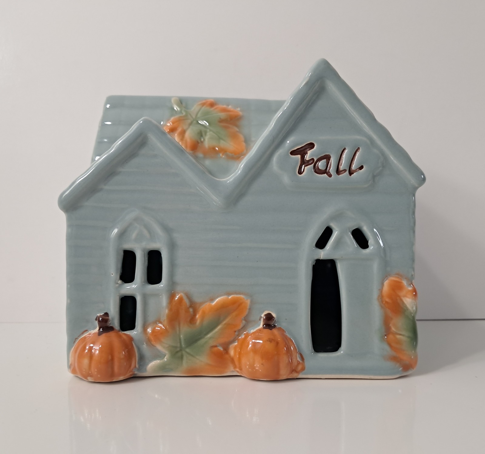 Fall-themed Light Up Haunted House Blue Ceramic 5.5x5x4″ Pumpkins Leaves