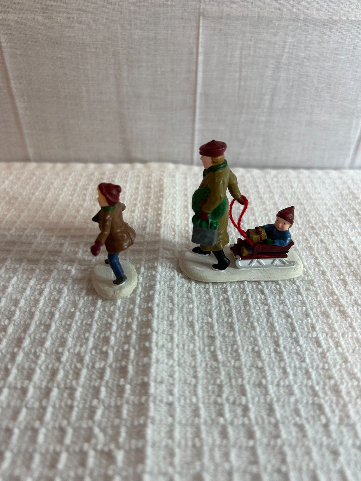 DEPT 56 FIGURES SET OF 2 ALL AROUND THE PARK SINGLE BOY, MAN & BOY IN SLED
