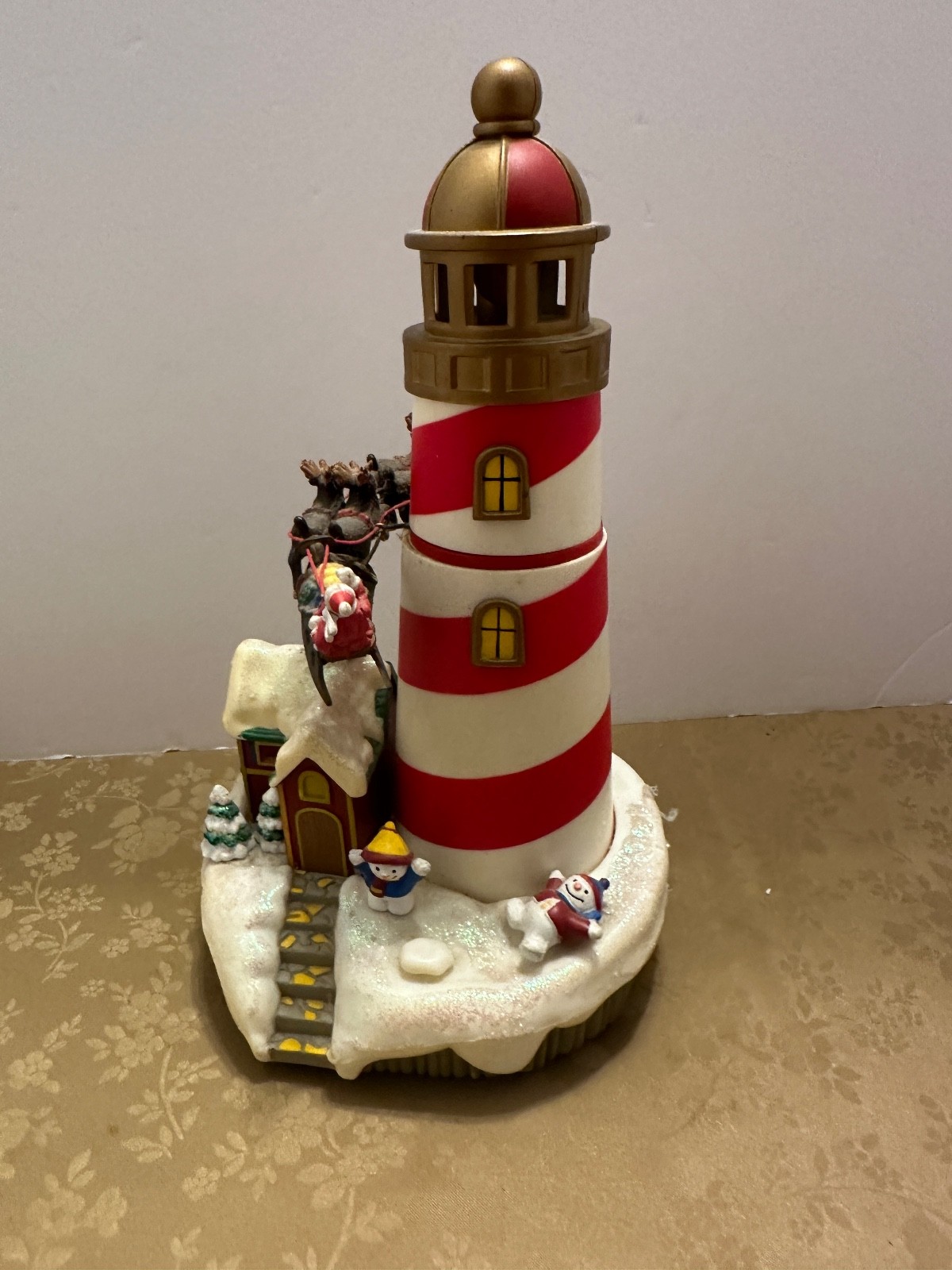 Village Lighthouse With Music And Santa And Reindeer Go Around 9.25″ Tall READ