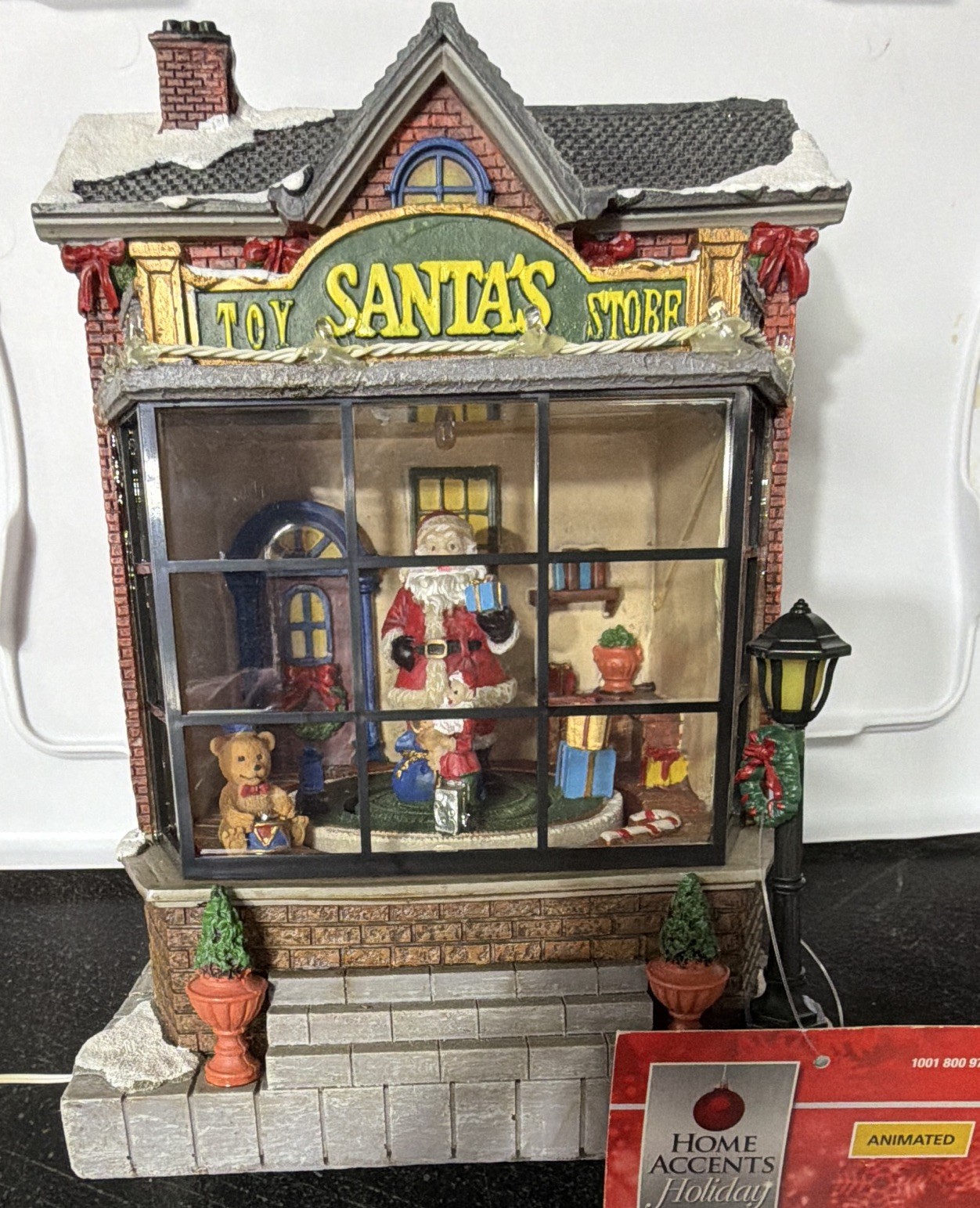 Home Accents Holiday Animated Musical Santa’s Toy Store 9.5in-not working