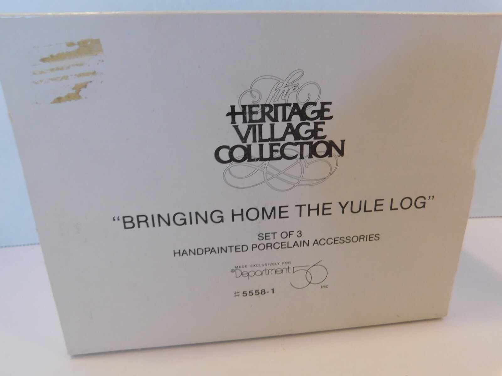 HERITAGE VILLAGE COLLECTION “BRINGING HOME THE YULE LOG” #5558-1 IN ORIGINAL BOX