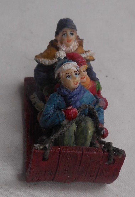 Christmas Village Kids riding on a Sled Figurine 2-1/4″L x 1″ W x 1-1/2″ H Resin
