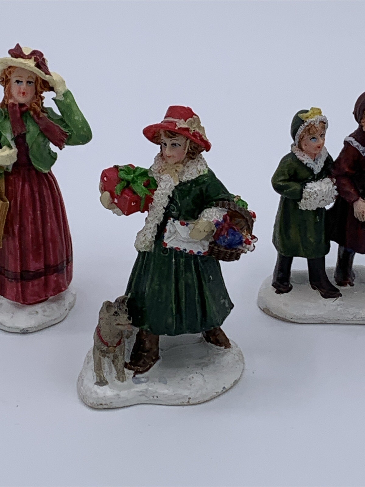 Lot of 3 Unbranded Christmas Village Figurines Tallest is 2.5 inches