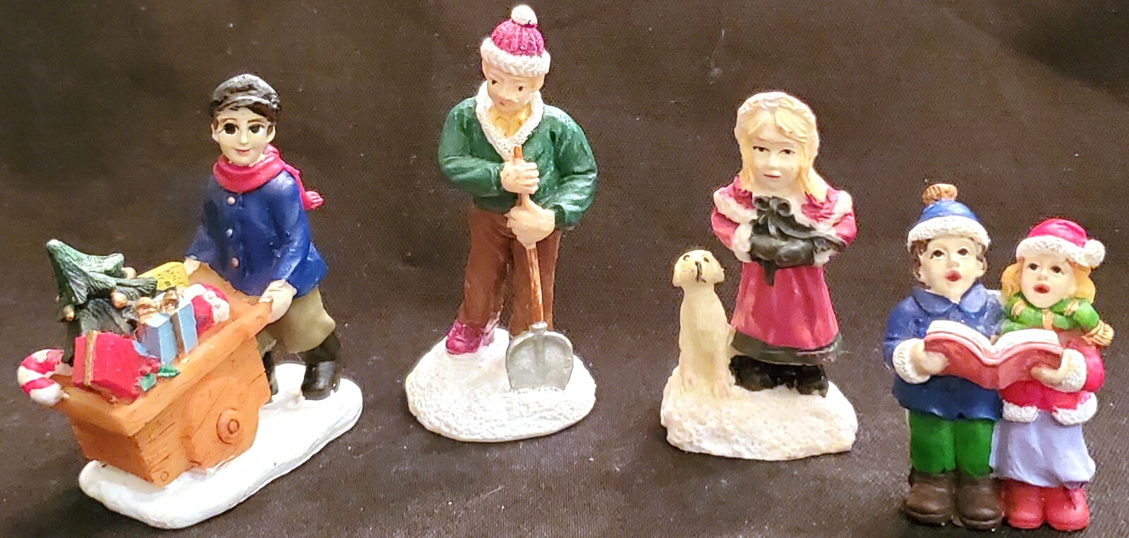 Christmas Village 4 resin figures BOY WITH CART KIDS CAROLING MAN & SHOVEL DOG