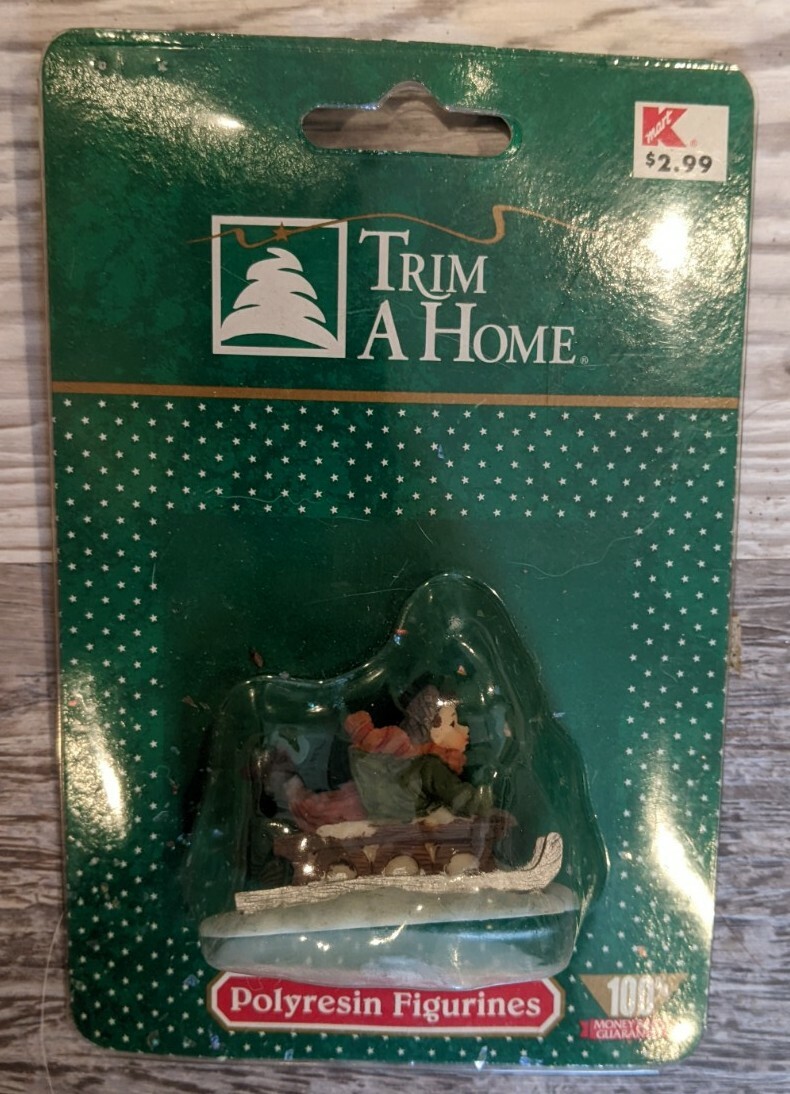 K-Mart Trim At Home Polyresin Figurine Boy On Sled NOS Village Accessory