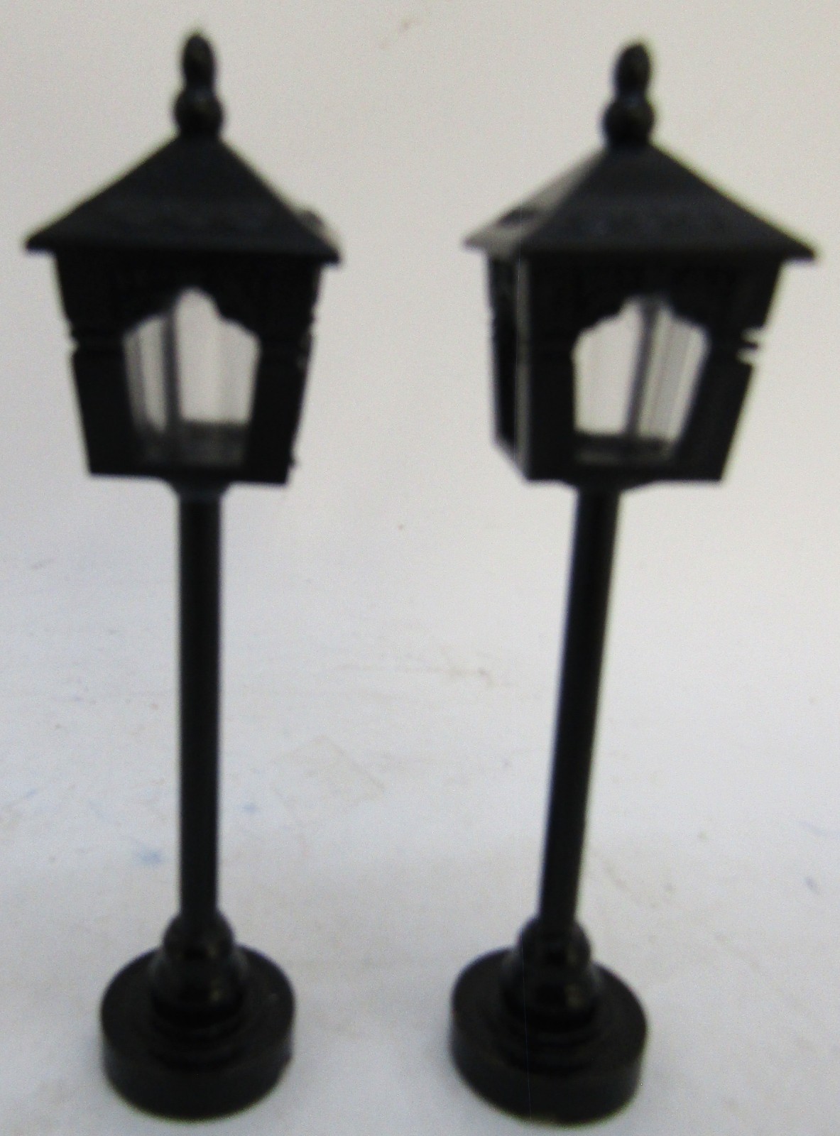 Vintage 4 Porcelain Christmas Village Figurines + 2 Metal Lampposts.