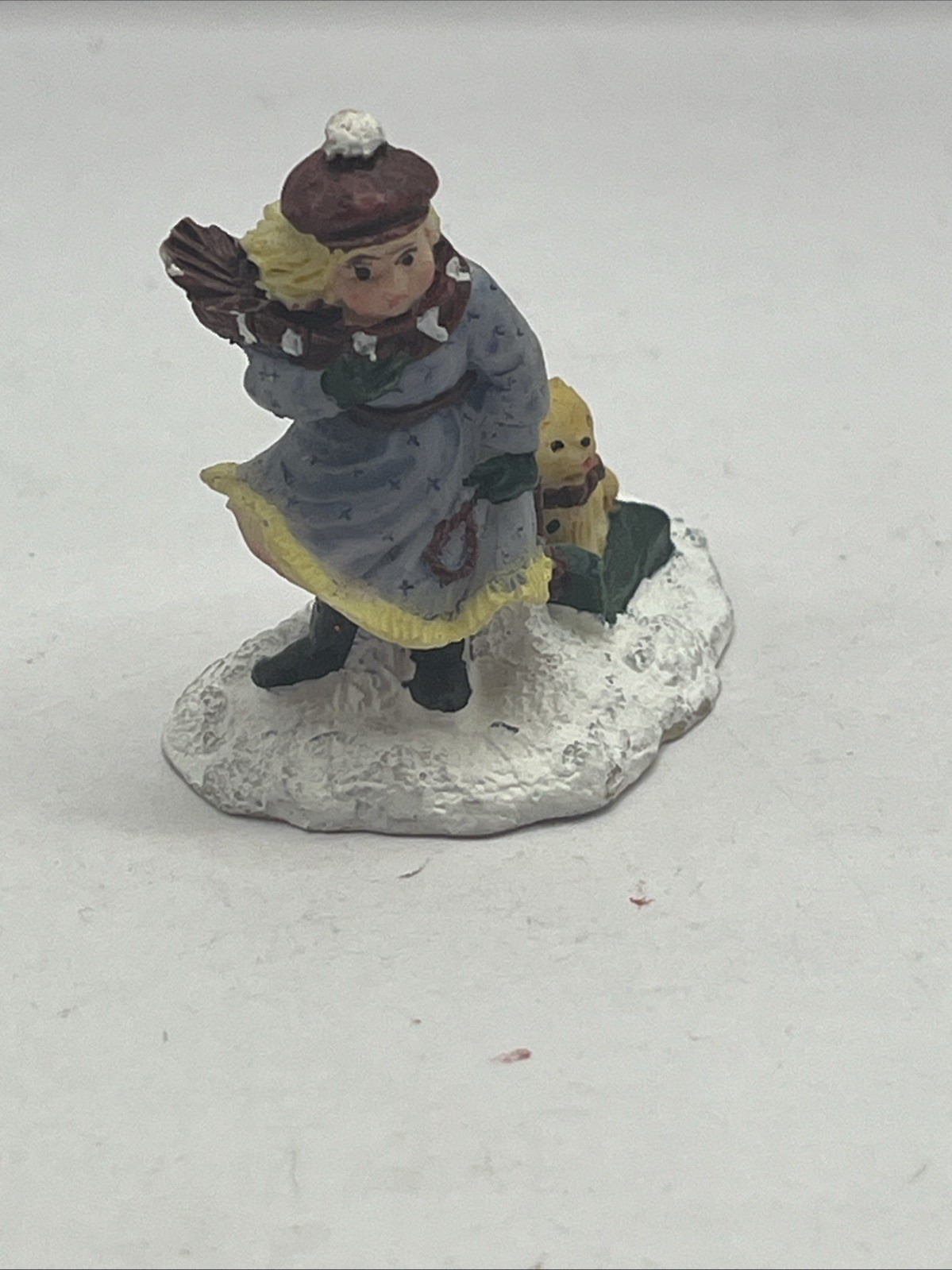 Vintage Mervyn’s Christmas Village Square figurine Girl Pulling Sled With Dog On