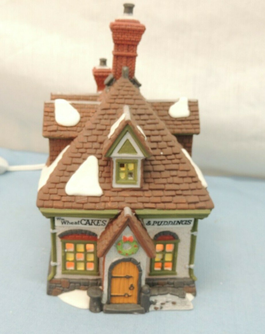 HERITAGE VILLAGE COLLECTION, DICKENS’ VILLAGE,”WM. WHEAT CAKES & PUDDINGS”