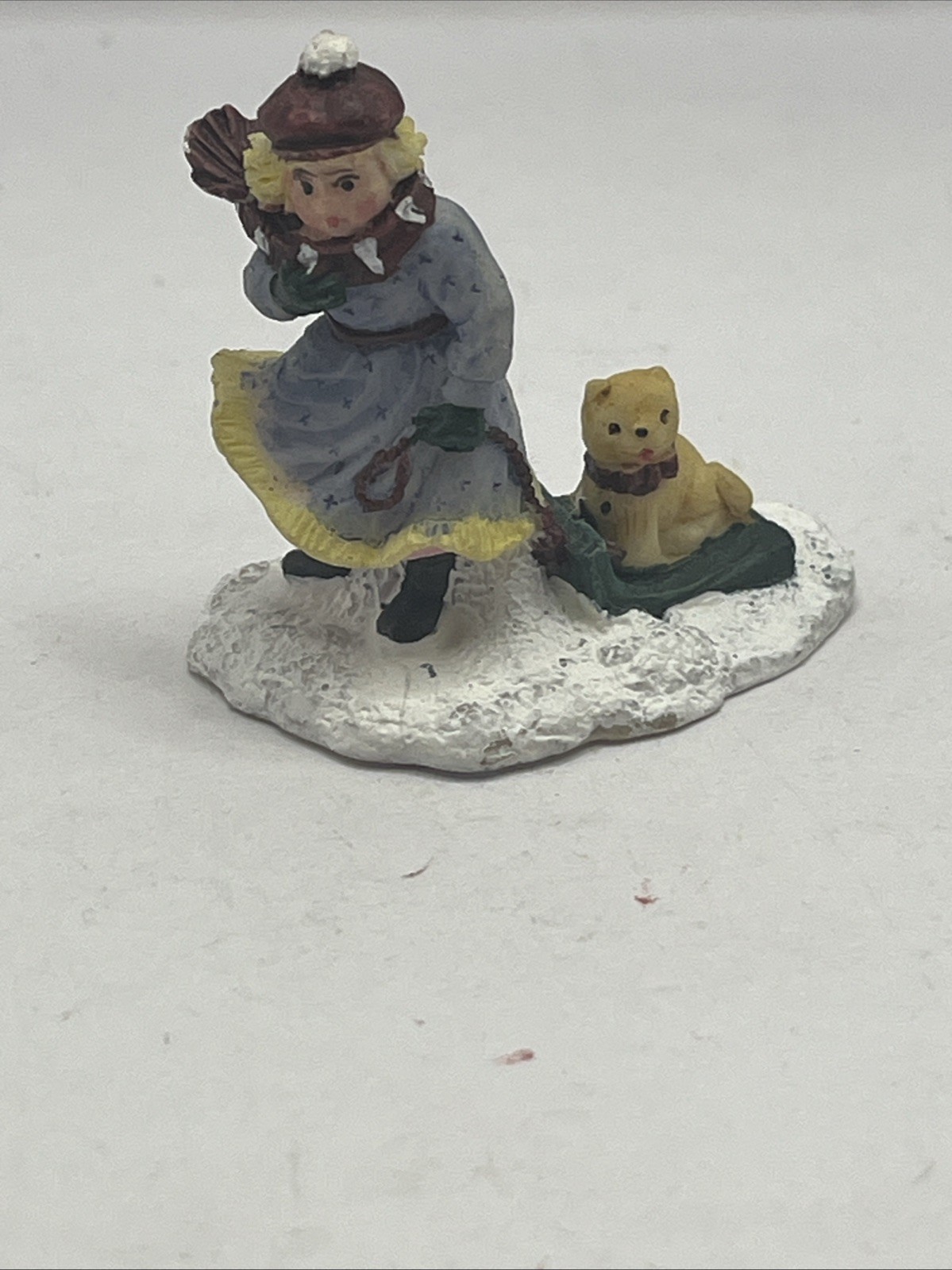 Vintage Mervyn’s Christmas Village Square figurine Girl Pulling Sled With Dog On