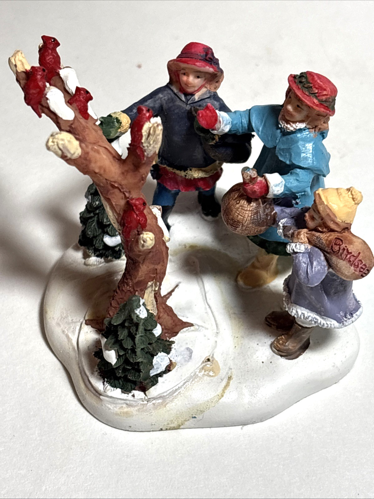 2 Christmas Village Figurines, Resin Figures on Snow Bases, approx 2.5 in high