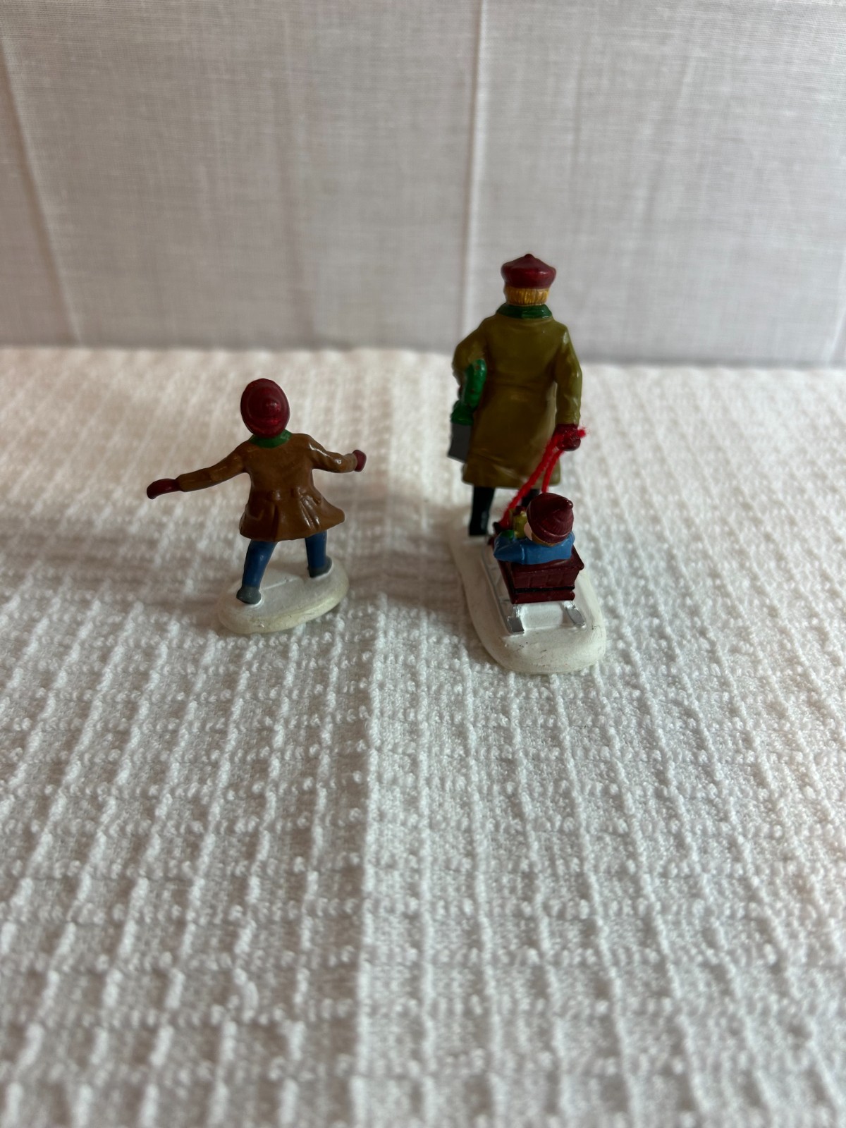 DEPT 56 FIGURES SET OF 2 ALL AROUND THE PARK SINGLE BOY, MAN & BOY IN SLED