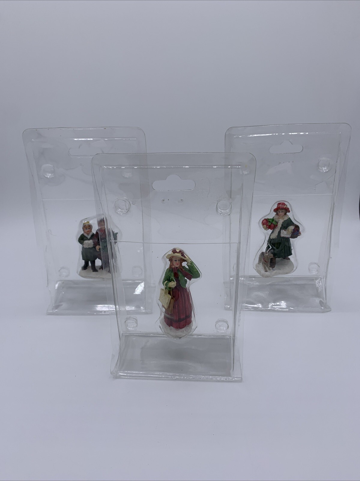 Lot of 3 Unbranded Christmas Village Figurines Tallest is 2.5 inches