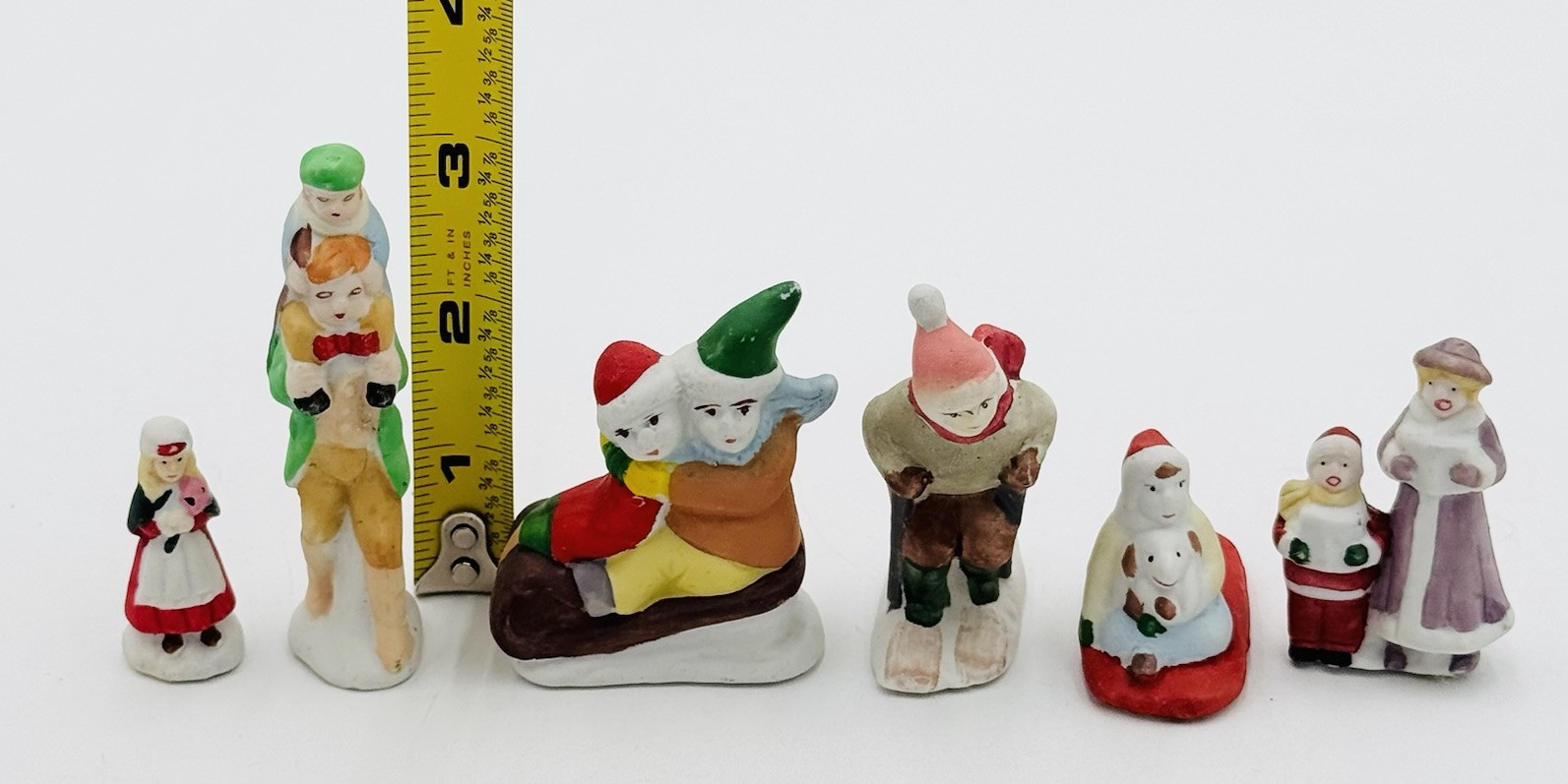 6 Christmas Village Figures Ceramic Skiing Sledding Towns People Kids Flaw
