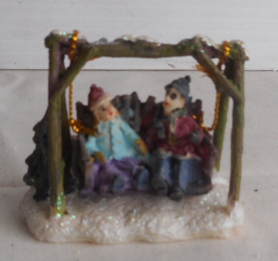 Village Miniatures Kids On A Swing in the Snow during Holidays 2-3/8″ W