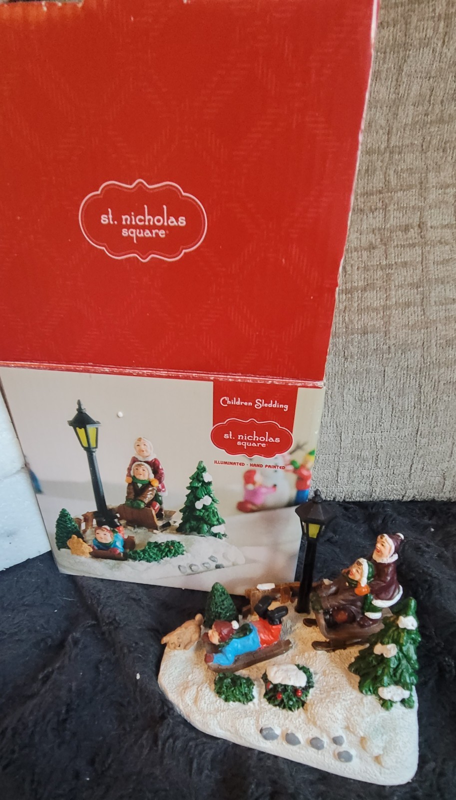 St. Nicholas Square Village, “Children Sledding”. Lights up #9