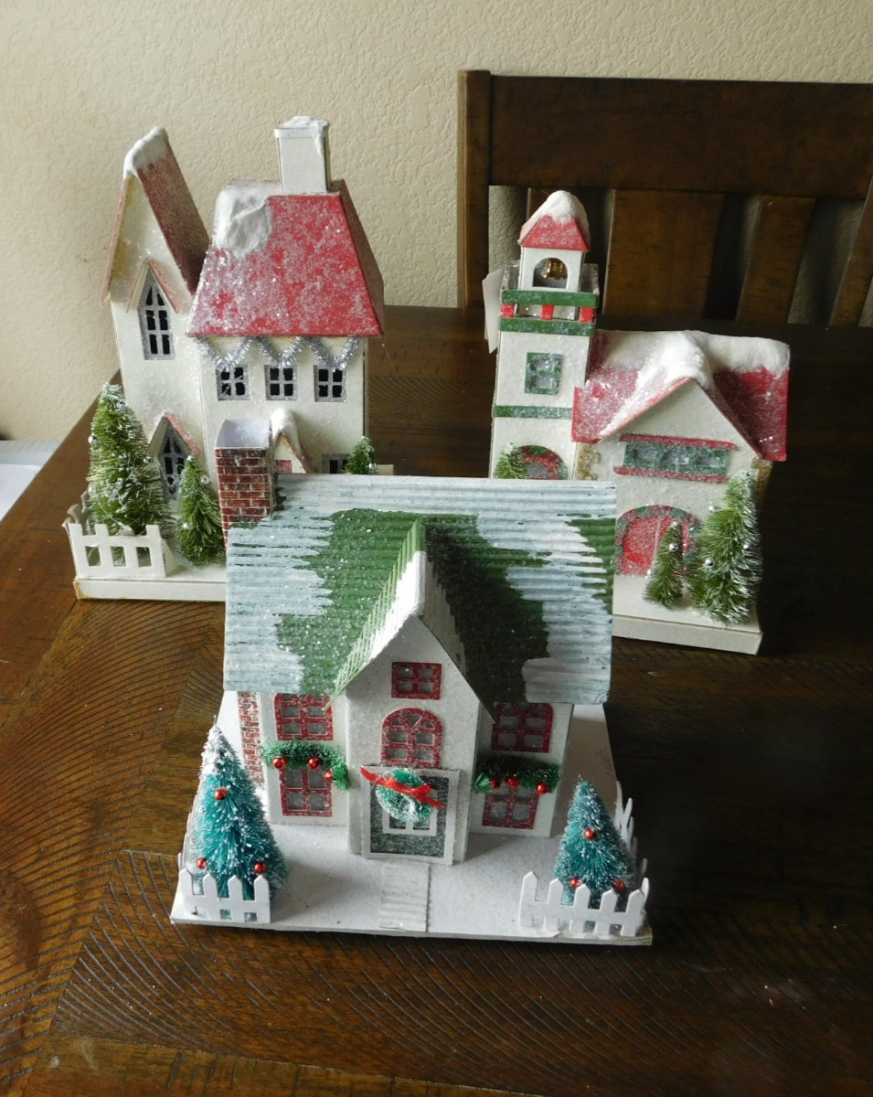 3 CARDBOARD VILLAGE HOUSES ARE DECORATED WITH GLITTER & LIGHT UP + 3 ORNAMENTS