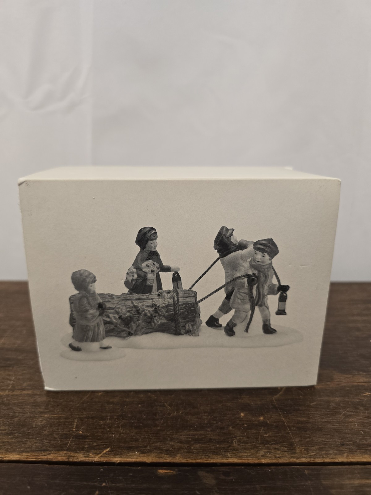 NIB Dept 56 The Heritage Village Collection “Bringing The Yule Log” Figurines