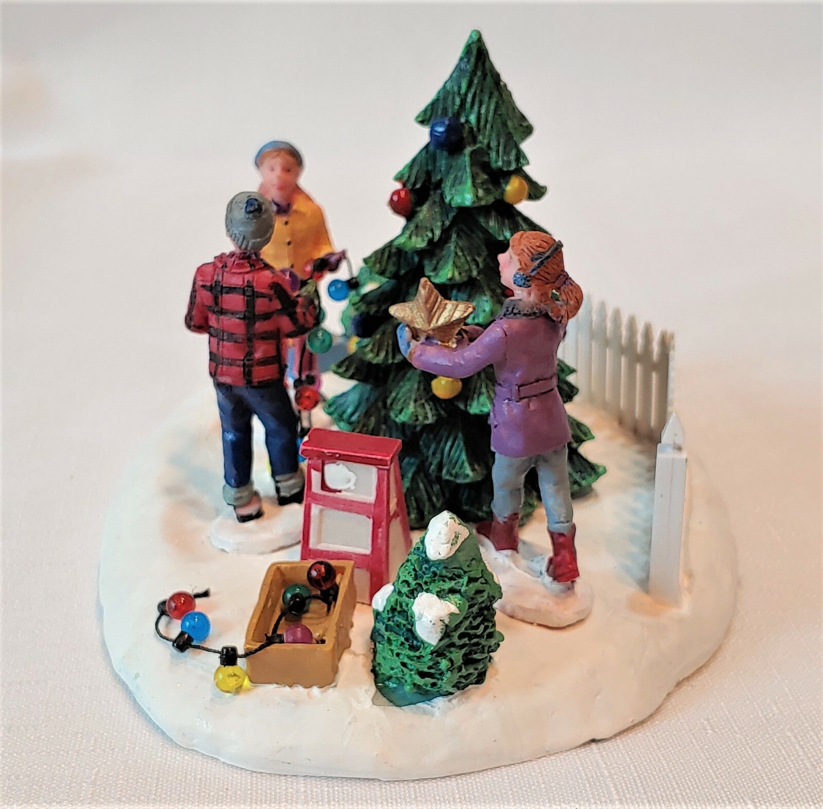 Christmas Village “Decorating The Tree”