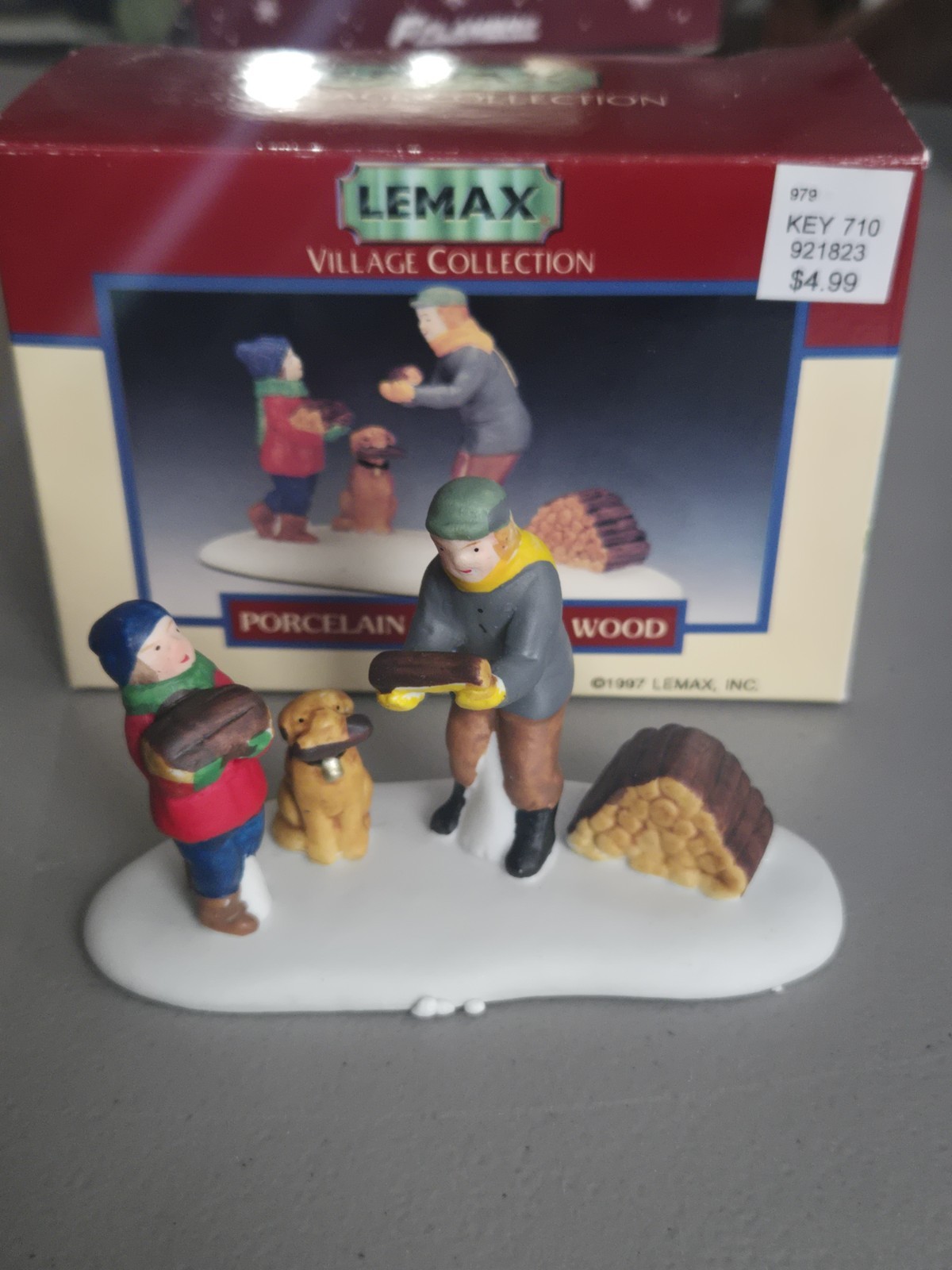 Vintage 1997 Lemax Village Collection Porcelain Carrying Wood Figure