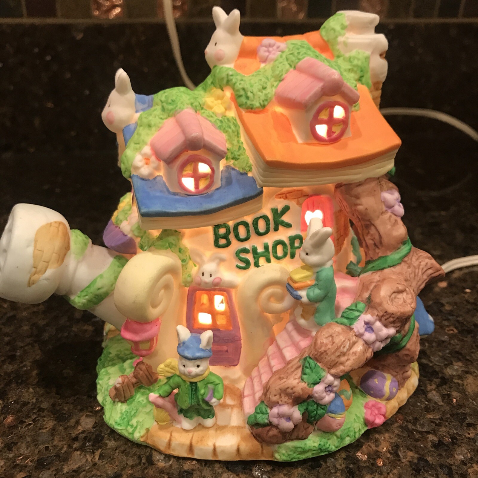 Easter Village ” Book Shop” has water can shape light up house EUC 6 in tall