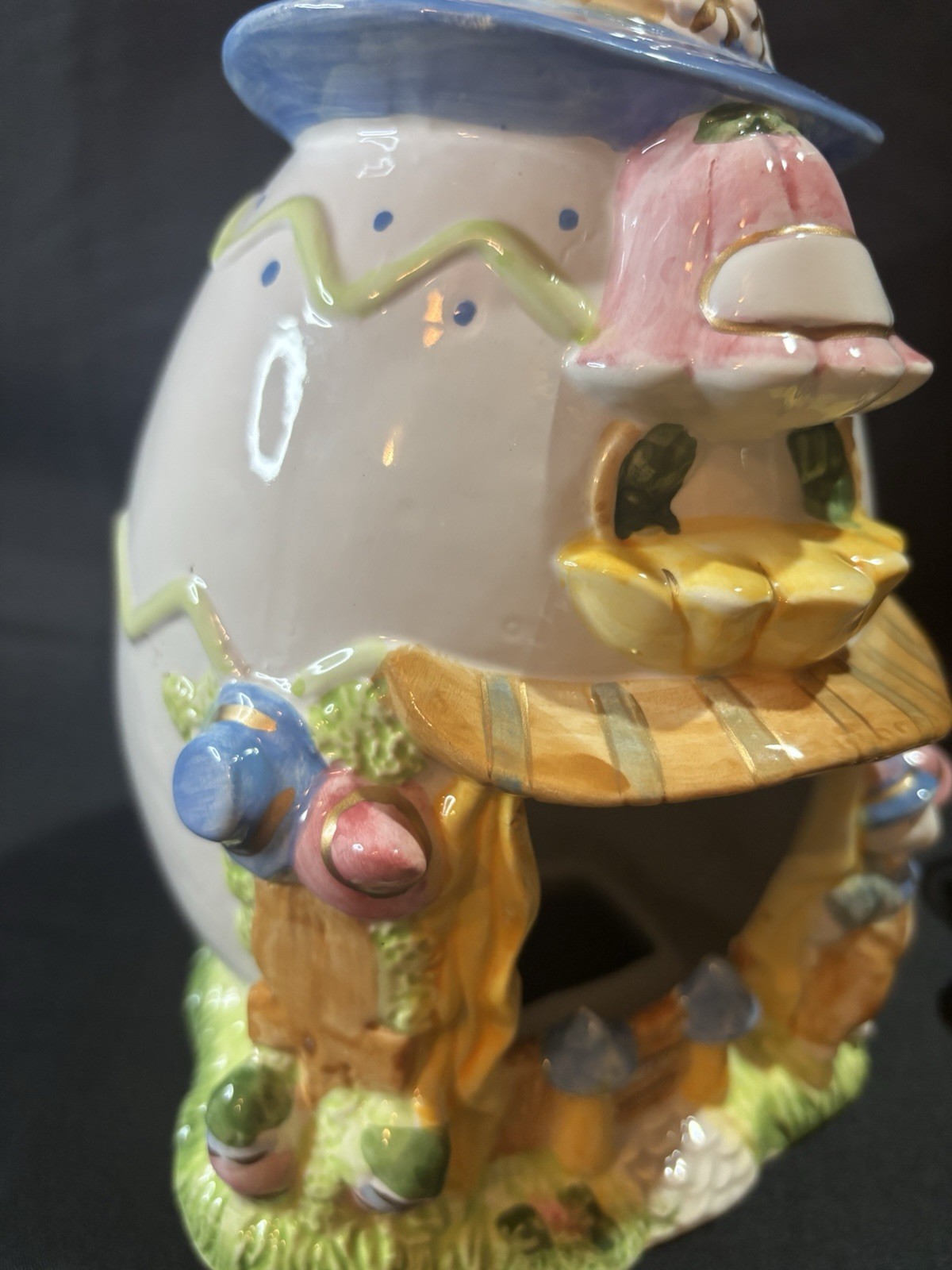 ceramic Easter egg shaped bunny house candle votive holder.