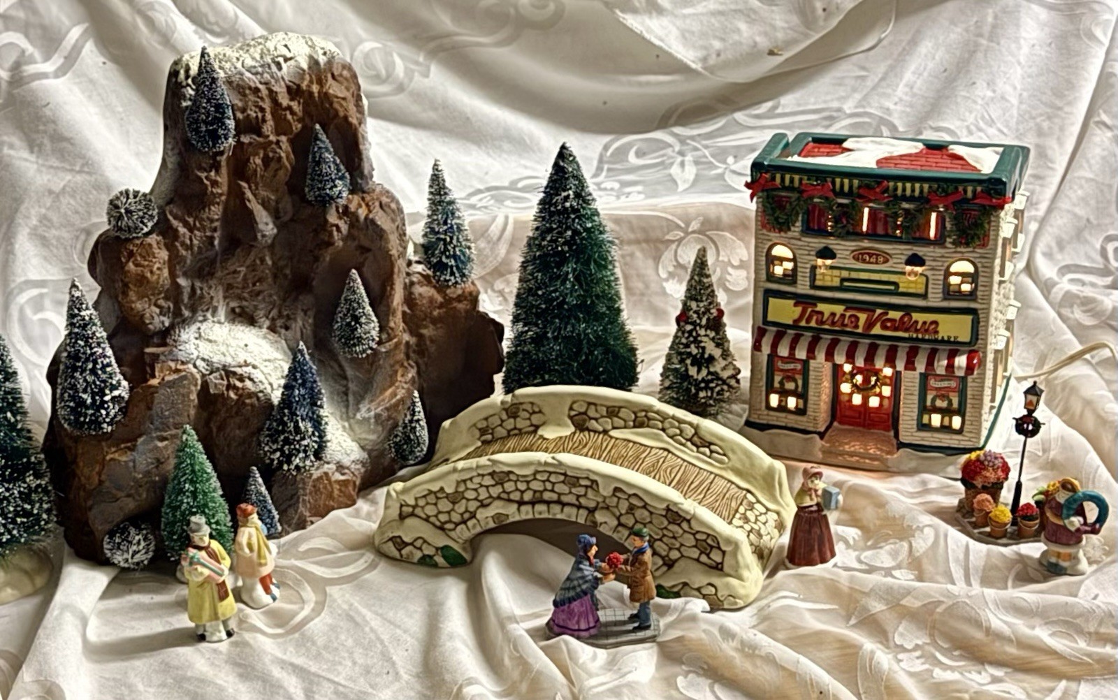 9 Piece Christmas Village Lot Including Illuminated True Value Hardware Store
