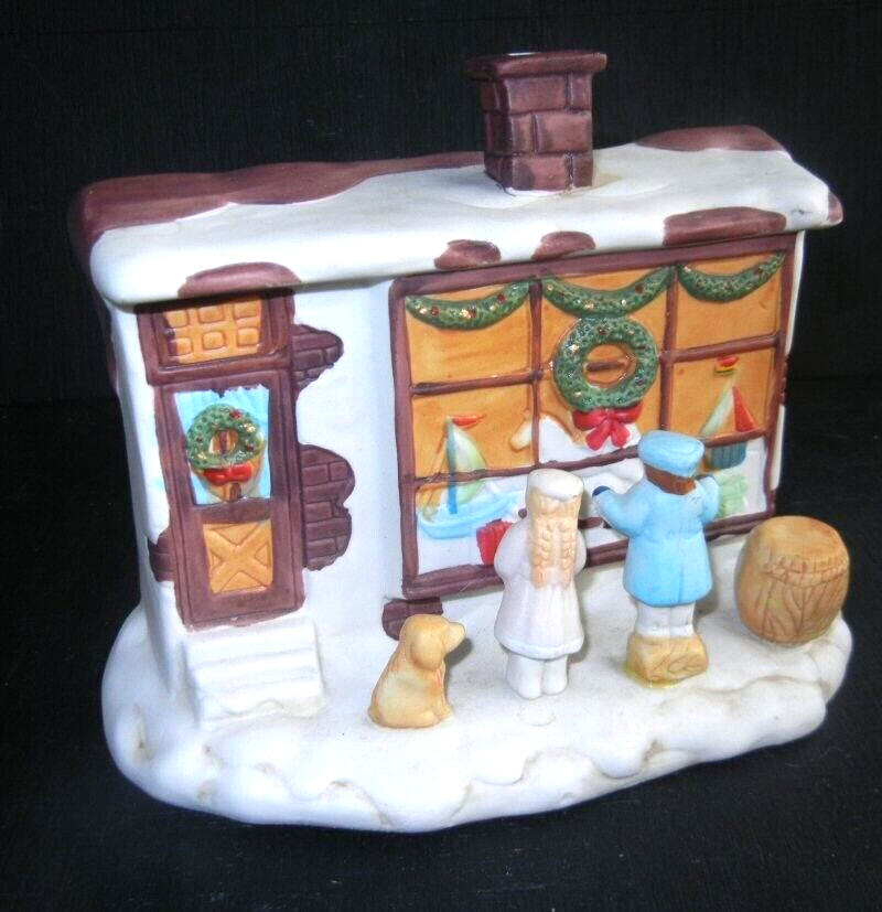 R.O.C CHILDREN & DOG IN FRONT OF THE LIGHTED TOY STORE FRONT WINDOW PORCELAIN