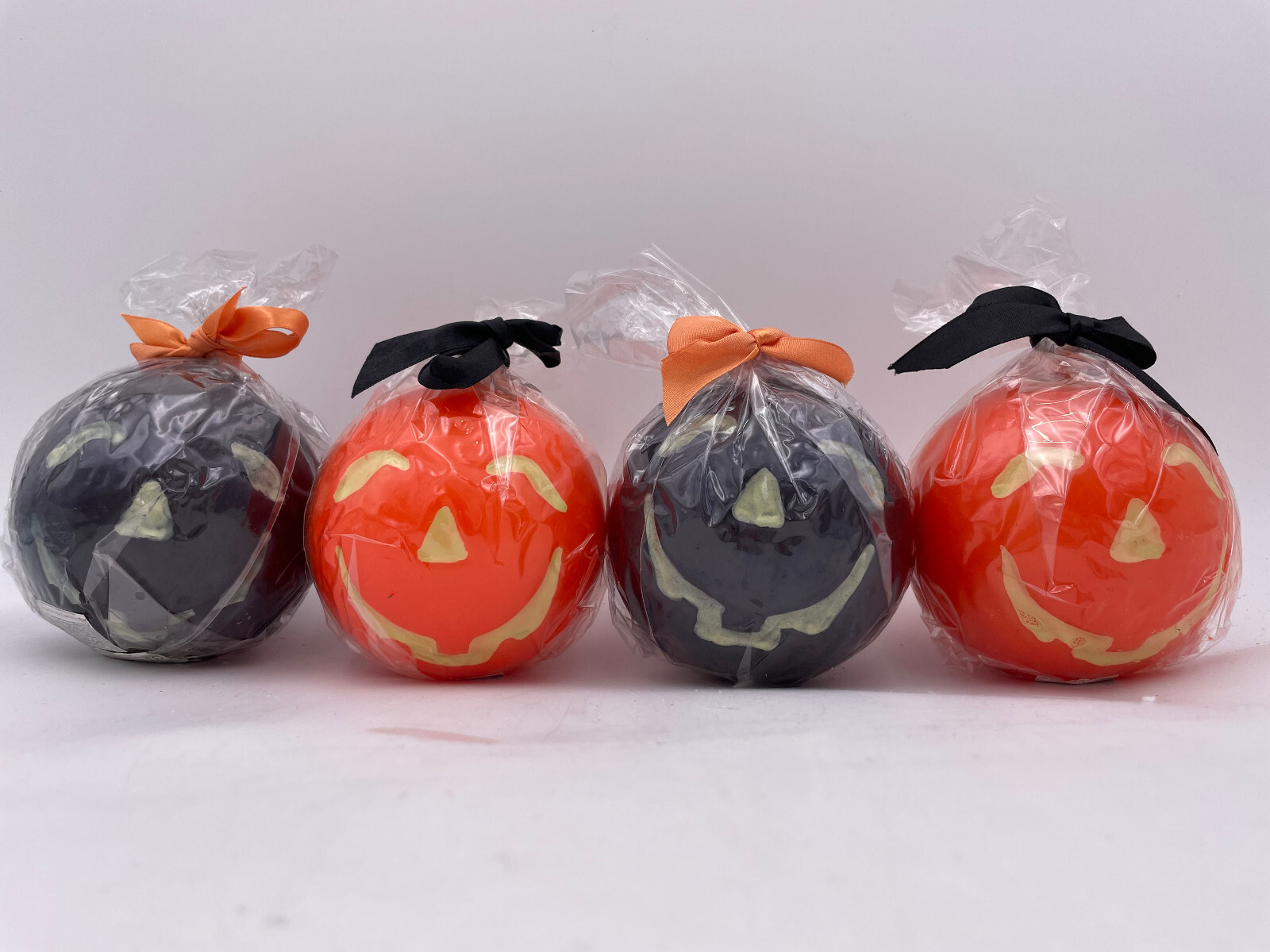 Department 56 – Set of 4 Small Orange & Black Pumpkin Candles #34862