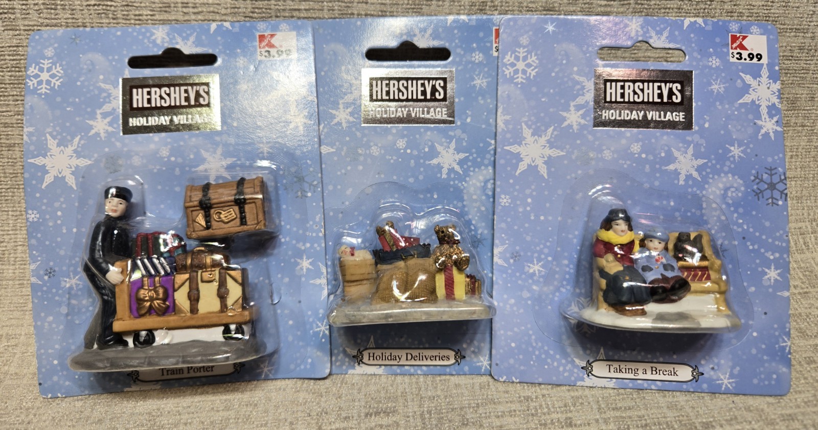 Hershey’s Holiday Village-3 Pieces-Train Porter, Taking a Break, and Packages