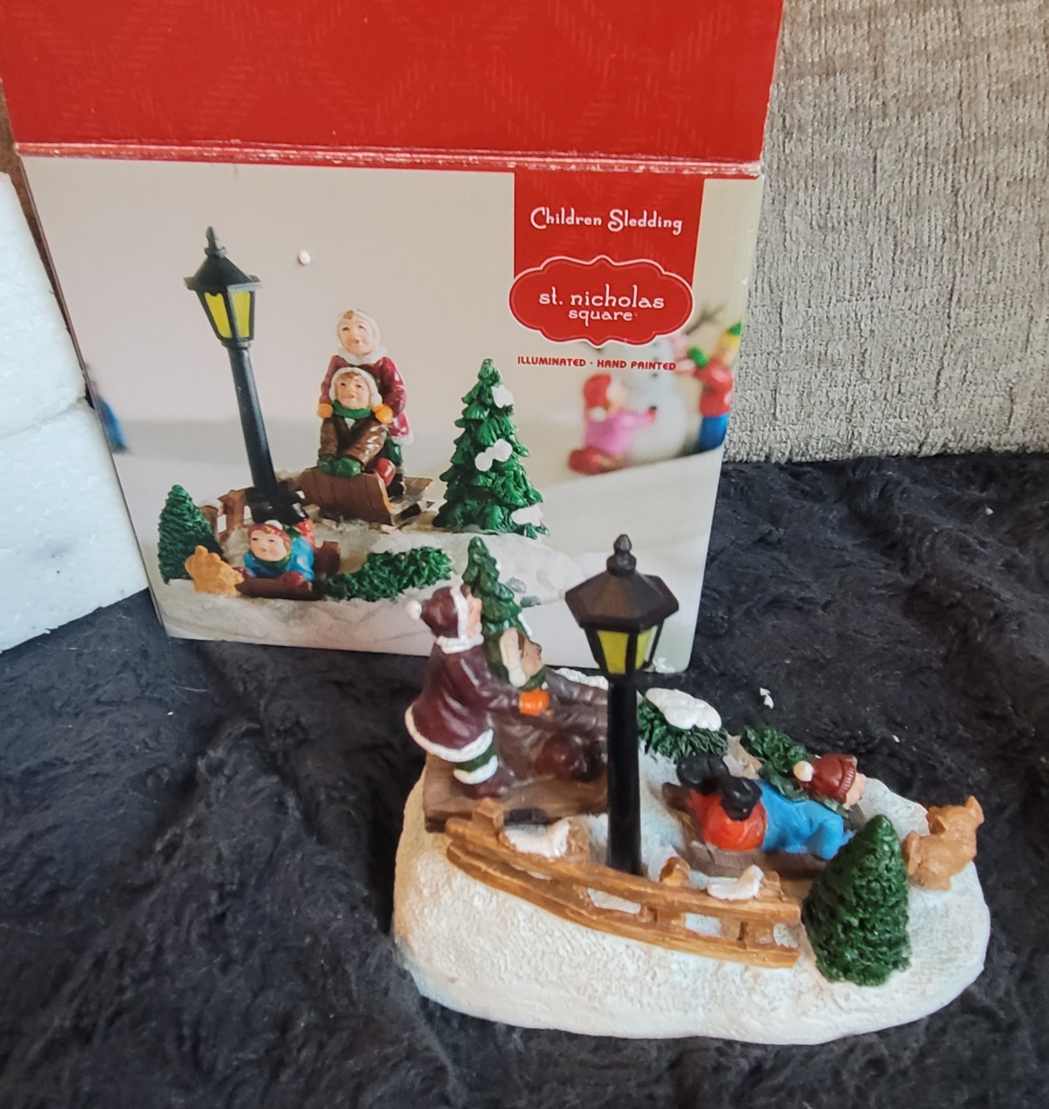 St. Nicholas Square Village, “Children Sledding”. Lights up #9