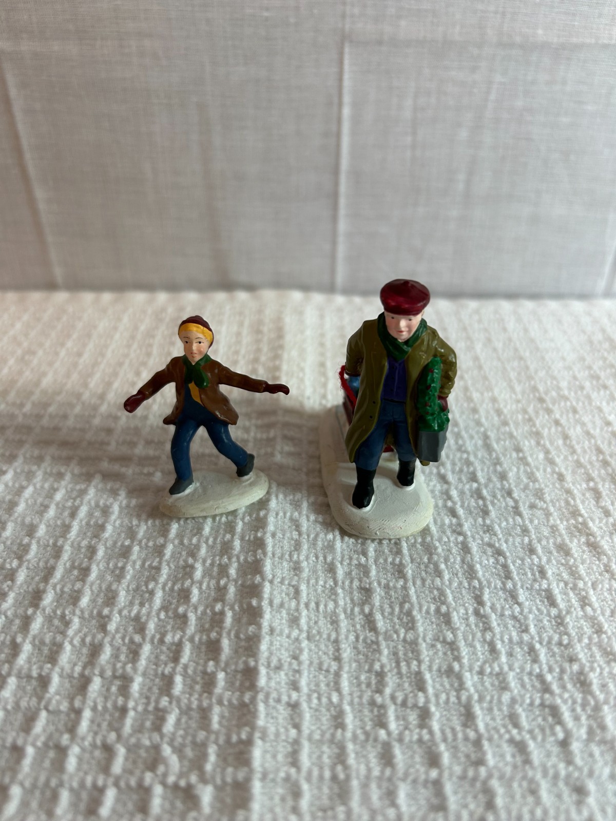 DEPT 56 FIGURES SET OF 2 ALL AROUND THE PARK SINGLE BOY, MAN & BOY IN SLED