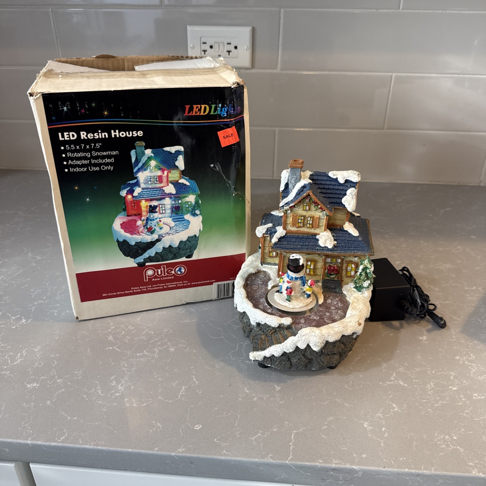 Puleo LED Christmas Resin Snowman that moves and house with plug in adapter