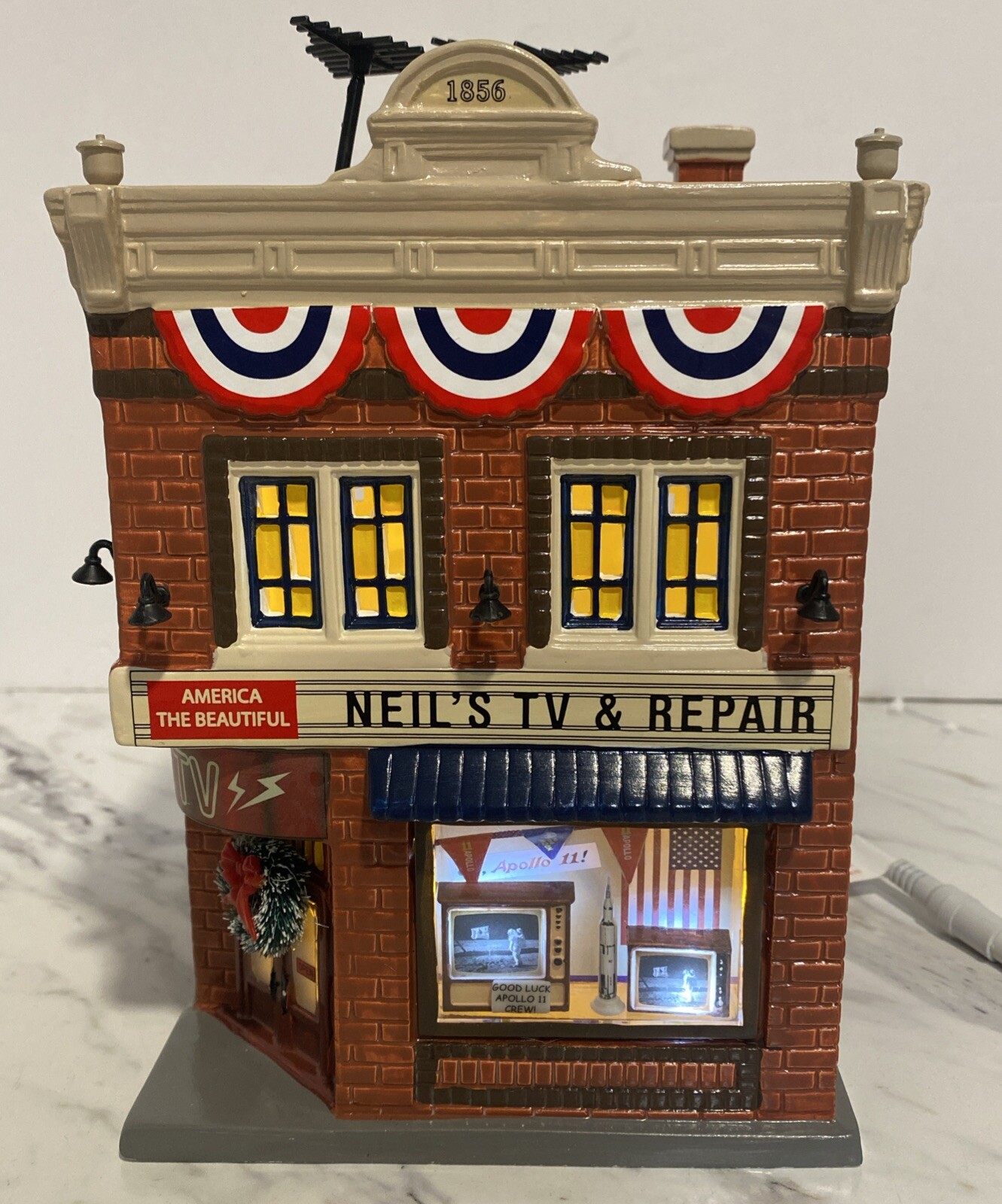 Department 56 Snow Village Neil’s TV & Repair – Numbered Limited ED #6003136