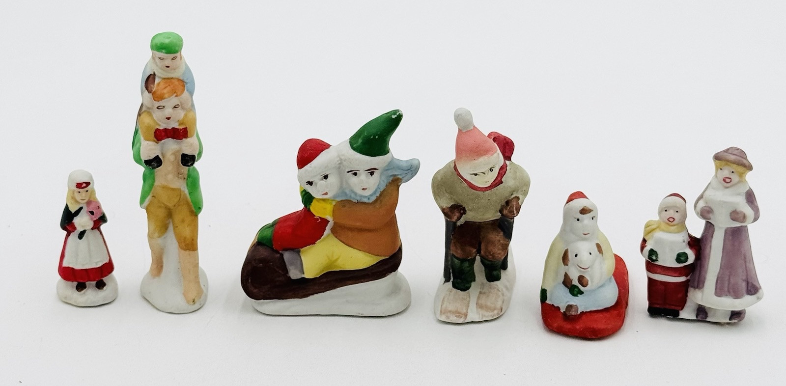 6 Christmas Village Figures Ceramic Skiing Sledding Towns People Kids Flaw
